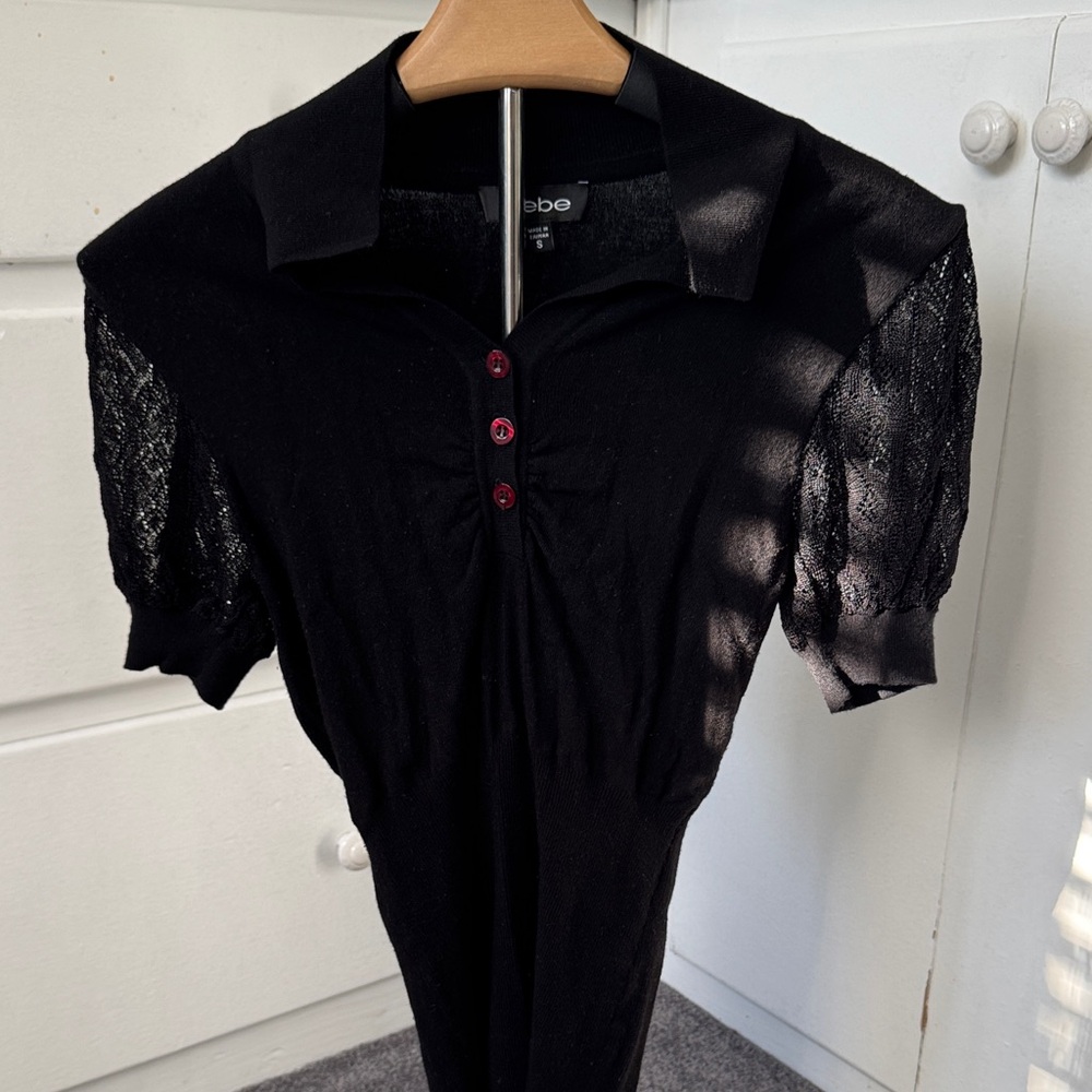 Bebe Black Blouse with patterned semi opened Sleeves size small mostly rayon